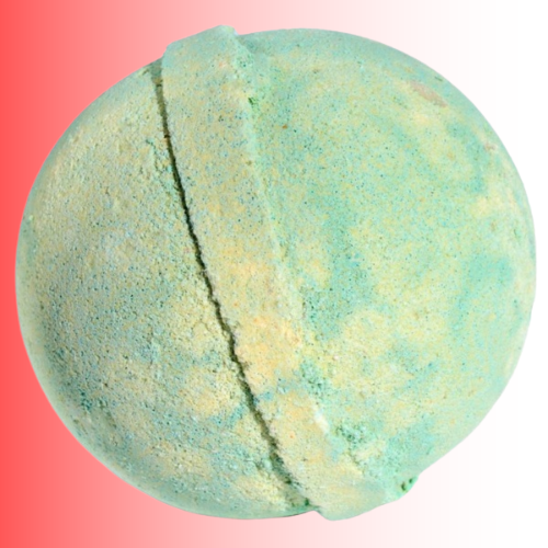 Green and yellow bath bomb on a gradient pink and white background. For customers in the Kenosha and Racine area