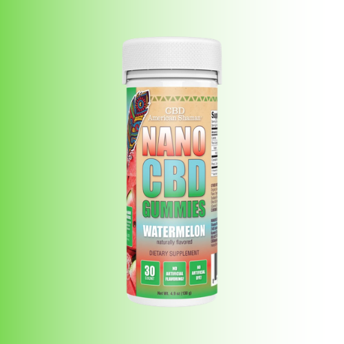 A bottle of American Shaman Nano CBD Gummies Watermelon flavor, featuring a white cap and a colorful label with green, orange, and red text, set against a light green gradient background.
