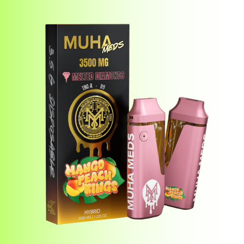 Pink vape device with 'Muha Meds Mango Peach Kings' branding and packaging on a gradient background. For customers in the Kenosha and Racine area