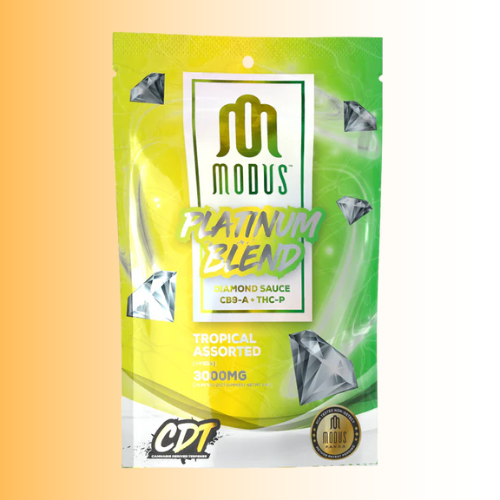 Green and yellow package of Modus Platinum Blend Diamond Sauce Tropical Assorted on a gradient background. For customers in the Kenosha and Racine area