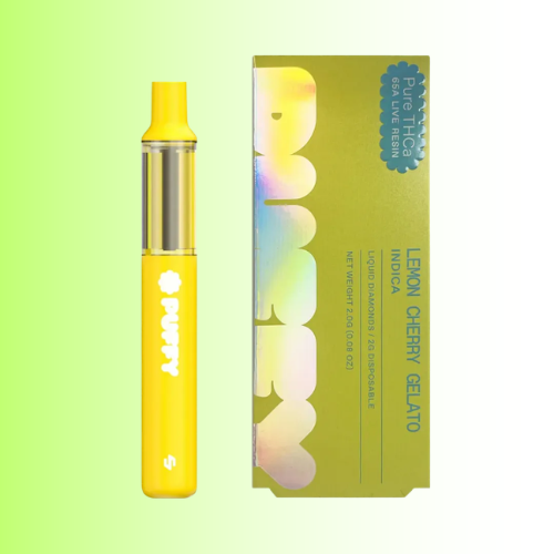 A yellow disposable vape pen and its matching green packaging box with holographic lettering, set against a light green gradient background.