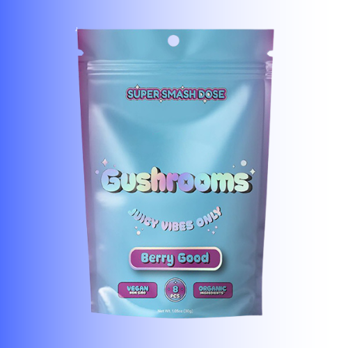 A stand-up resealable pouch of Gushrooms Berry Good gummies, Berry Good Flavor featuring a light blue and purple gradient design with colorful text and icons, set against a blue-to-white gradient background.