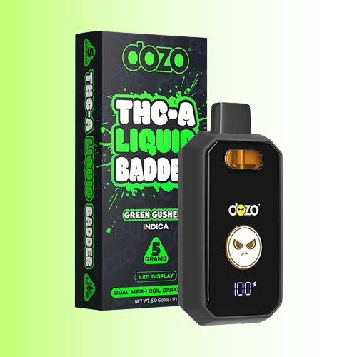 A black Dozo THC-A Liquid Badder Green Gusher disposable vape device next to its black retail packaging box with bright green text, set against a light green gradient background.